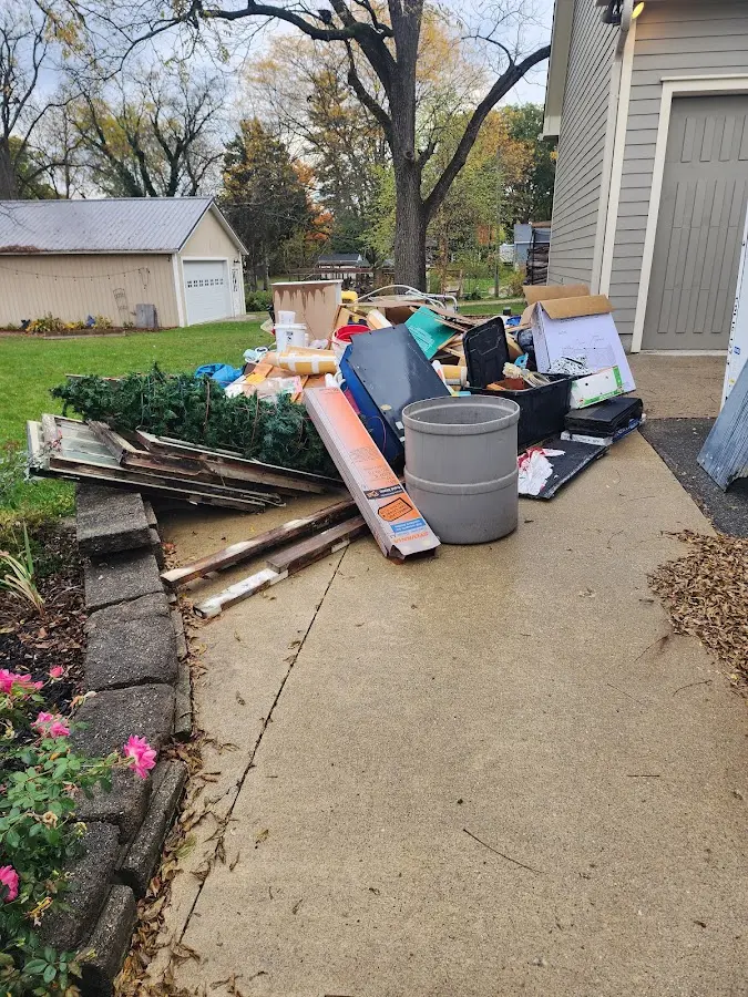 Dumpster being loaded with debris for Residential Dumpster Rental in Fort Carson